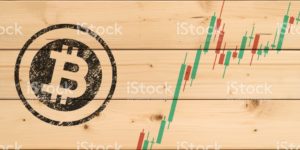 Cryptocurrency concept (Bitcoin chart on the plank)2