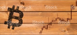 Cryptocurrency concept (Bitcoin chart on the plank)1